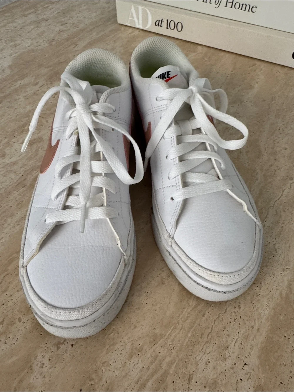 Nike White Low-Top Sneakers with Mauve Swoosh